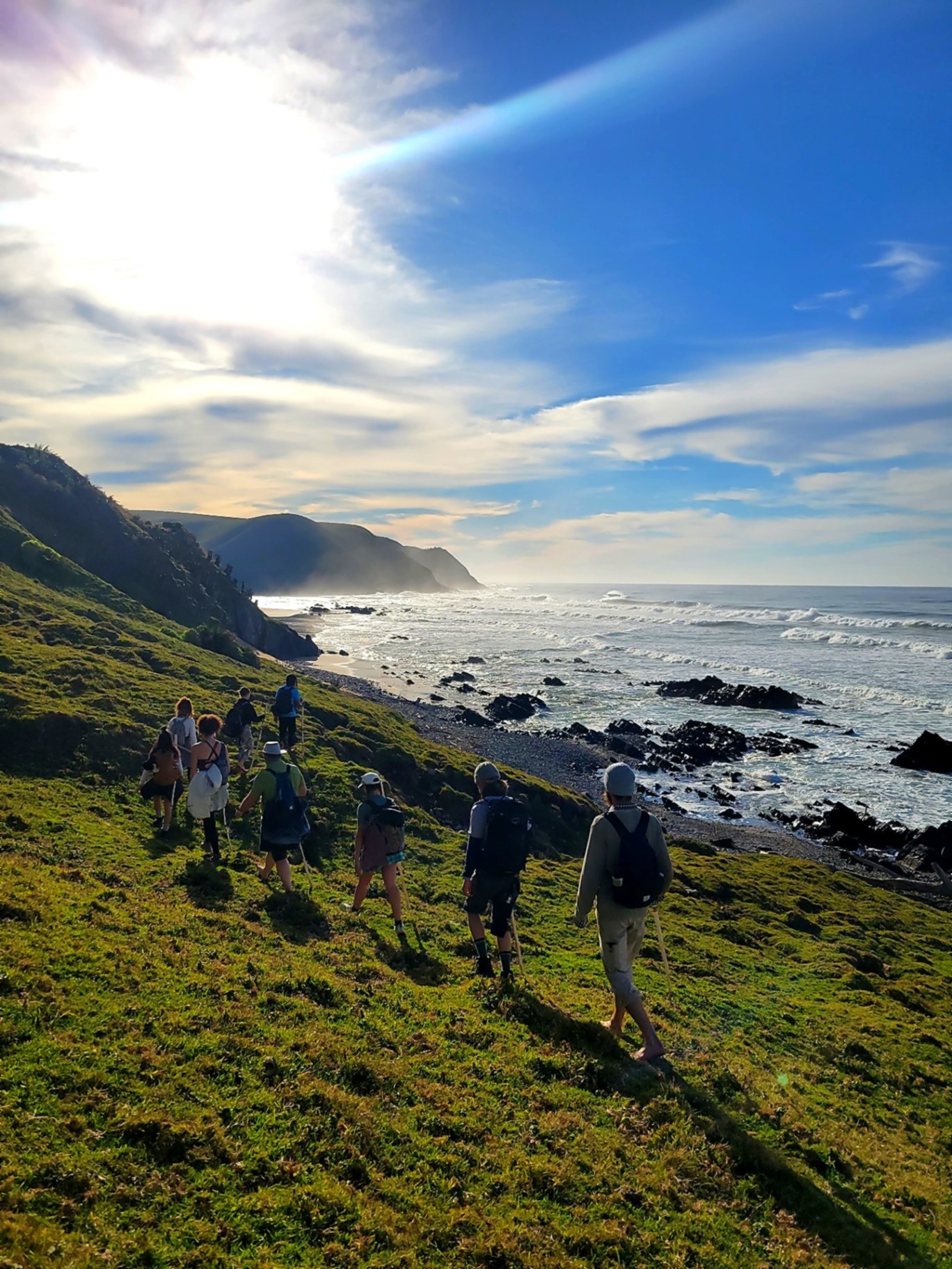 Coastal group hike along the shore